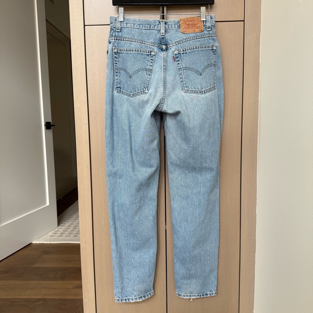 Vintage Levi’s 550 Distressed Light Blue Jeans, 10